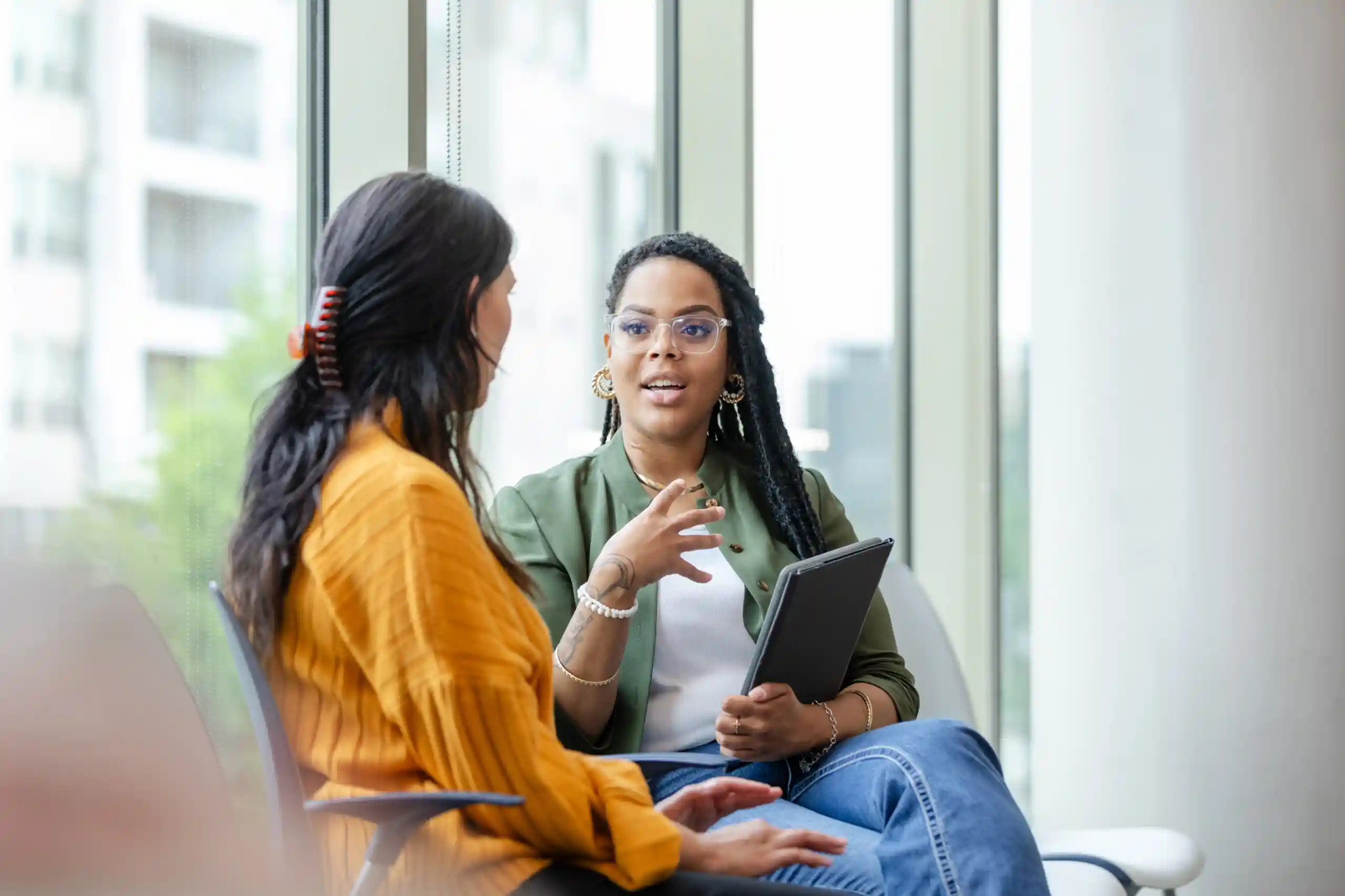 Two women discussing